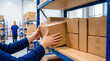 © Joselito - Close-up of a person's hands carefully placing a brown cardboard box onto a metal shelving unit inside a busy warehouse.