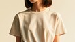 © Punnn - Minimalist Portrait: A young woman with a chic bob haircut is captured in a close-up shot, wearing a simple cream t-shirt against a soft, warm backdrop.