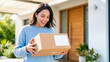 © CK Studio - Happy woman receiving online shopping delivery package at modern home entrance, showcasing convenience and customer satisfaction.