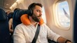 © Sukon - Passenger enjoying a comfortable flight journey with music and headphones on a plane.