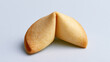 © A2Z AI  - Single golden dessert cookie with a hidden message, often associated with good fortune and predictions on a clean studio background