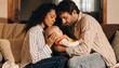 © Rohan - Loving parents cradle their newborn on a cozy sofa at home, suggesting family bonding, parental care, and warm advertising for baby products.