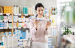 © JackF - Girl in autumn clothes buys medicinal ointment or gel at a pharmacy