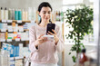 © JackF - Girl in autumn clothes scans code on package of paracetamol pills to check the expiration date
