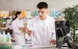 © JackF - Portrait of male pharmacist working at computer in a pharmacy