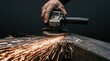 © SimpleDesignStudio - Metal Grinding with Angle Grinder Creating Sparks by Skilled Industrial Worker in Workshop for Metal Fabrication