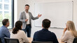 © Aino Minako - Professor Teaching Adult Business Class With Blank Whiteboard
