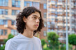© Valerii Honcharuk - Profile portrait of curly teen boy outdoors