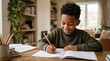 © Eve - Smiling young black boy writing in textbook focusing on homework task at wooden table. Diligent school kid studying at home, elementary education, early learning and smart child concept.