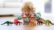 © vasyl pshyk - Child plays with toy dinosaurs on a wooden floor in a bright room during the afternoon
