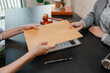 © PHOTO4U - Professional legal consultation between a lawyer and client discussing contracts, legal rights, case strategy, and document review in modern law office, representing justice, trust, and legal services