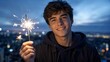 © BAGAS - Happy Young Man Holding a Burning Sparkler at Night with City Bokeh Background