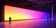 © Lustre Art Group  - People explore vast immersive venue with yellow, pink, and blue gradient wall, reflective floor, and industrial ceiling. Fits XR events, digital signage, and tech branding.