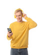© Pixel-Shot - Young blonde man in headphones using mobile phone on white background