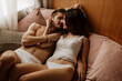 © Westend61 - Intimate young couple lying in bed
