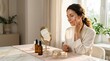 © Mohsin - Woman applies luxurious skincare cream to face in elegant morning routine