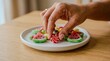 © Arx PhotoStock - A hand reaching for a colorful swirl lollipop candy on a white plate with other candies.