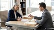 © spyrakot - Businesswoman signing legal documents during meeting with attorney