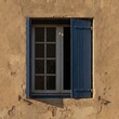© KIMOG - Old Window with Open Blue Wooden Shutters on Rustic European House Facade