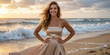 © Aleksei Solovev - Sunlit woman poses confidently on the beach, her wavy, tanned body showcased with champagne strapless dress with open sea behind.