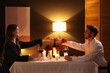 © New Africa - Date. Lovely couple having romantic dinner at table indoors