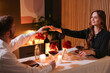 © New Africa - Date. Lovely couple having romantic dinner at table indoors