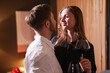 © New Africa - Date. Lovely couple with glasses of red wine at home