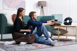 © New Africa - Date. Couple listening to vinyl record at home
