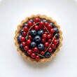 © KIMOG - Wild Berry Tartlet with Fresh Blueberries and Red Currants Isolated on White Background