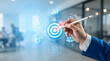 © Fyezzbd - Businessman drawing success target with digital icons on virtual screen
