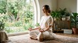 © Grey Std - Woman meditating cross-legged on floor in serene indoor garden setting