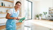 © CK Studio - Smiling woman cleaning glass table with spray and microfiber cloth in bright contemporary living room, residential cleaning service.
