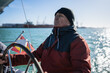 © Nazareno - Senior man sailing yacht navigating open water