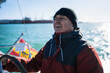 © Nazareno - Senior man sailing boat feeling adventure and freedom