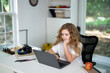 © Volodymyr - Laptop supports remote learning at home. Laptop lesson helps young student. Child laptop study looks focused. School laptop connects online education.