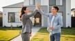 © Nor Adzman - Two People Celebrating a Successful Real Estate Deal Outdoors