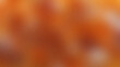 © Olivia Febriana - Abstract blurred background with warm orange and brown gradient tones.