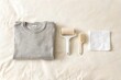 © Катерина Кучіна - Minimal Clothing Care Flat Lay with Sweater, Lint Roller and Brush
