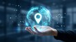 © TAFAZZUL - Hand holding digital glowing globe with location pin icon, representing global positioning system, navigation, and tracking technology
