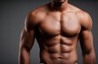 © The Little Hut - Close-up of a fit, muscular man's toned torso and defined abs against a plain backdrop
