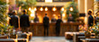 © Olga Ко - Blurred background of a luxury hotel lobby reception with unrecognizable silhouettes of guests and warm bokeh lights