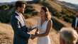 © Tania - Hilltop elopement with a justice of the peace reading from a phone, couple holding hands with eyes locked, wearing coordinated casual formal outfits, two close friends witnessing, late afternoon har