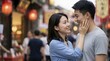 © Xenia - Asian female touching her boyfriend's face affectionately. Close up portrait of a happy romantic couple looking at each other on a festive street. Qixi Festival