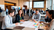 © Leo - Diverse business team collaborating on a project plan at a conference