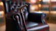 © twc - Elegant walking stick with a polished golden handle stands in a distinguished study, next to a classic leather armchair, evoking tradition and heritage