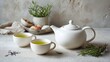 © Sinechana - 71.Tea concept scene featuring white teapot and two cups filled with herbal tea, simple table setting, neutral tones, relaxing and refreshing lifestyle mood