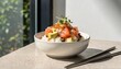 © Eshal - A bright bowl of salmon poke with rice, avocado, onions, and microgreens beside chopsticks suits healthy dining ads, seafood menus, or meal delivery promotions.