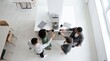 © Николай Срибяник - Diverse business team toasting with coffee in modern office