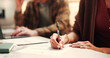 © peopleimages.com - Hands, documents and couple with writing, insurance and financial decision in home. Man, woman and application with signature, planning or policy for budget and premium or safety for asset management