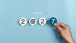 © Benjamas - Goals 2027 concept, and goal setting for the new year. growth, readiness, and the journey toward achieving success and chance. progress loading bar and goal icon. Hand holding paper number seven.